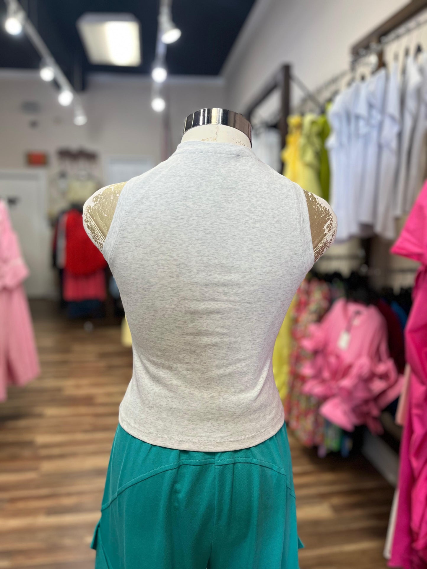 SLEEVELESS SHIRT WITH RHINESTONES