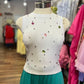 SLEEVELESS SHIRT WITH RHINESTONES